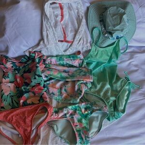 7 pc. Girls size 4-5 swim set. 3 swim suits, 1 cover-up, 1 hat